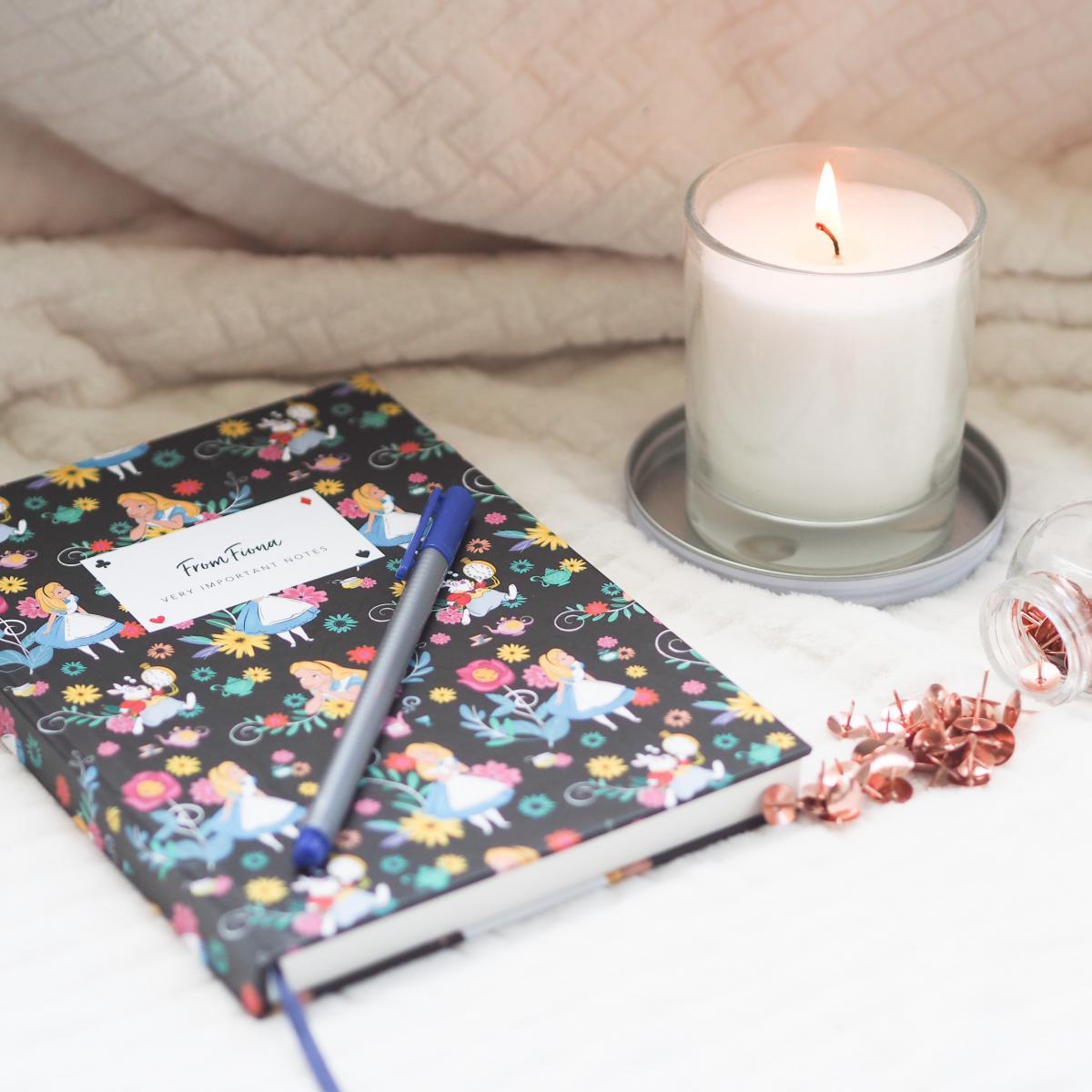 notebook, pen and candle flatlay